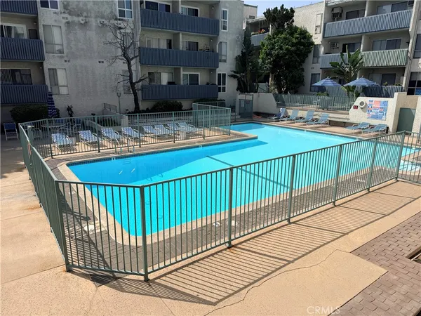 a view of a balcony with swimming pool