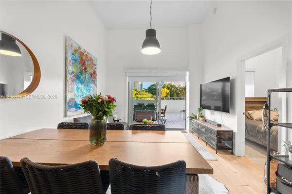 a living room with lots of furniture and a large window