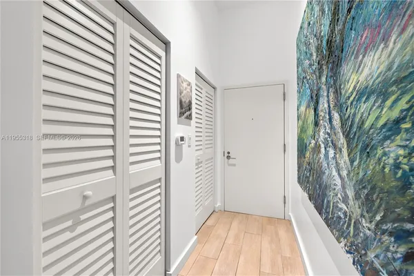a view of a bathroom from a corridor