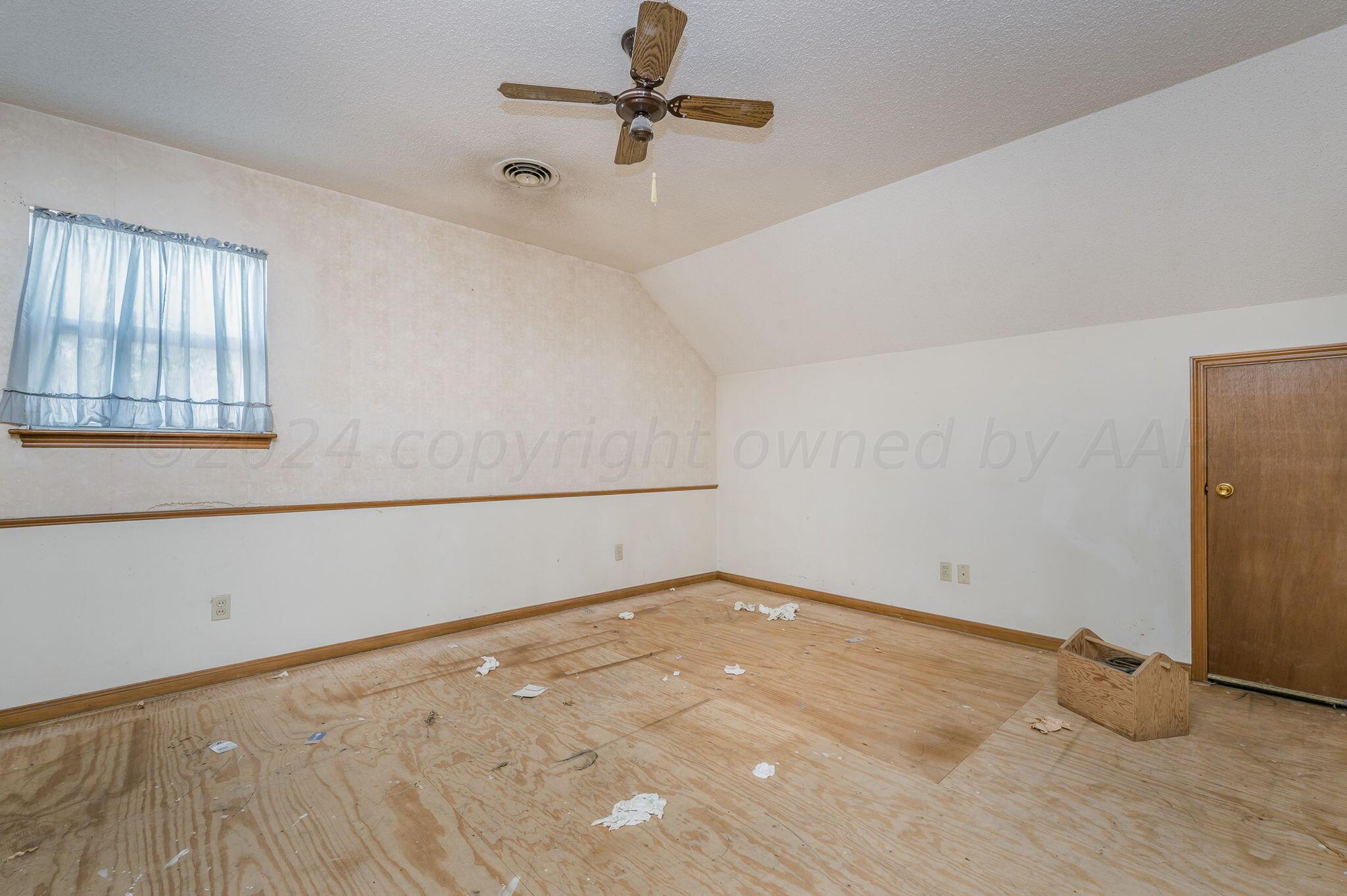 503 Cherry Avenue Dumas, TX 79029 - Photo 10 of 13 an empty room with windows