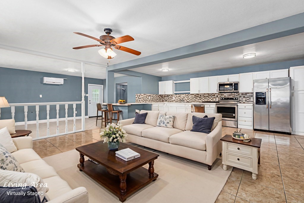 2915 Freeman Street Lufkin, TX 75901 - Photo 2 of 33 a living room with furniture kitchen view and a chandelier