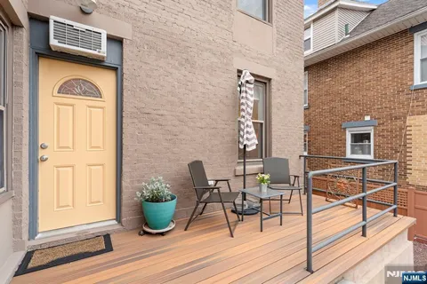 a view of house with outdoor seating