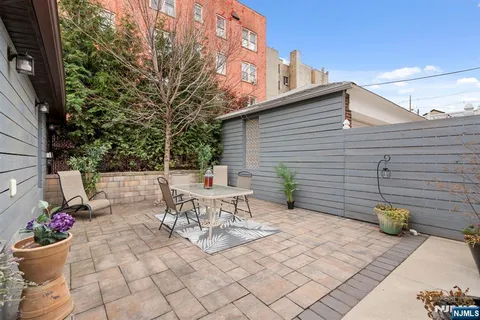 a view of outdoor sitting area with couch and chairs