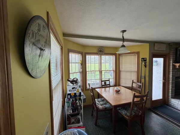 a view of a dining room with furniture window and outside view