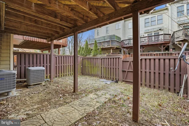 a view of a porch with wooden fence