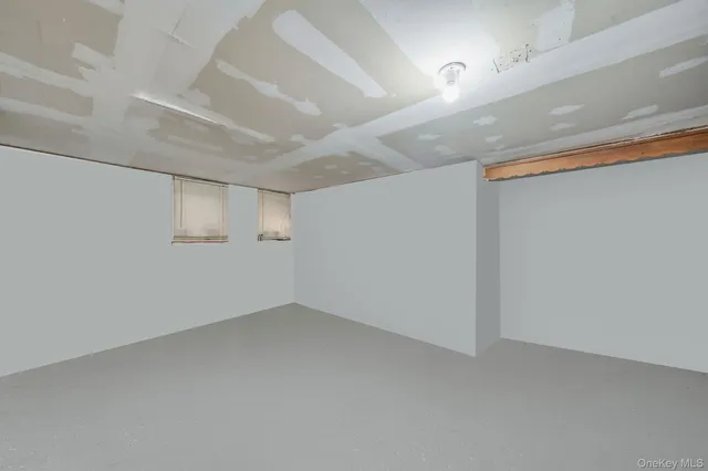 an empty room with a empty space and windows