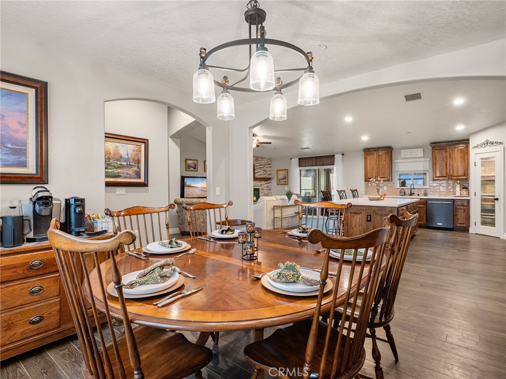 15620 Erie Road Apple Valley, CA 92307 - Photo 10 of 53 a view of a dining room with furniture and wooden floor