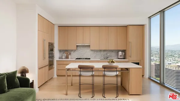 a kitchen with a table chairs stove and cabinets