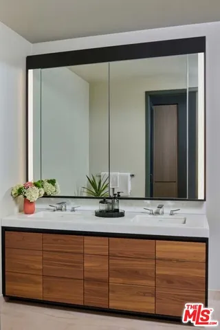 a bathroom with a sink and a mirror