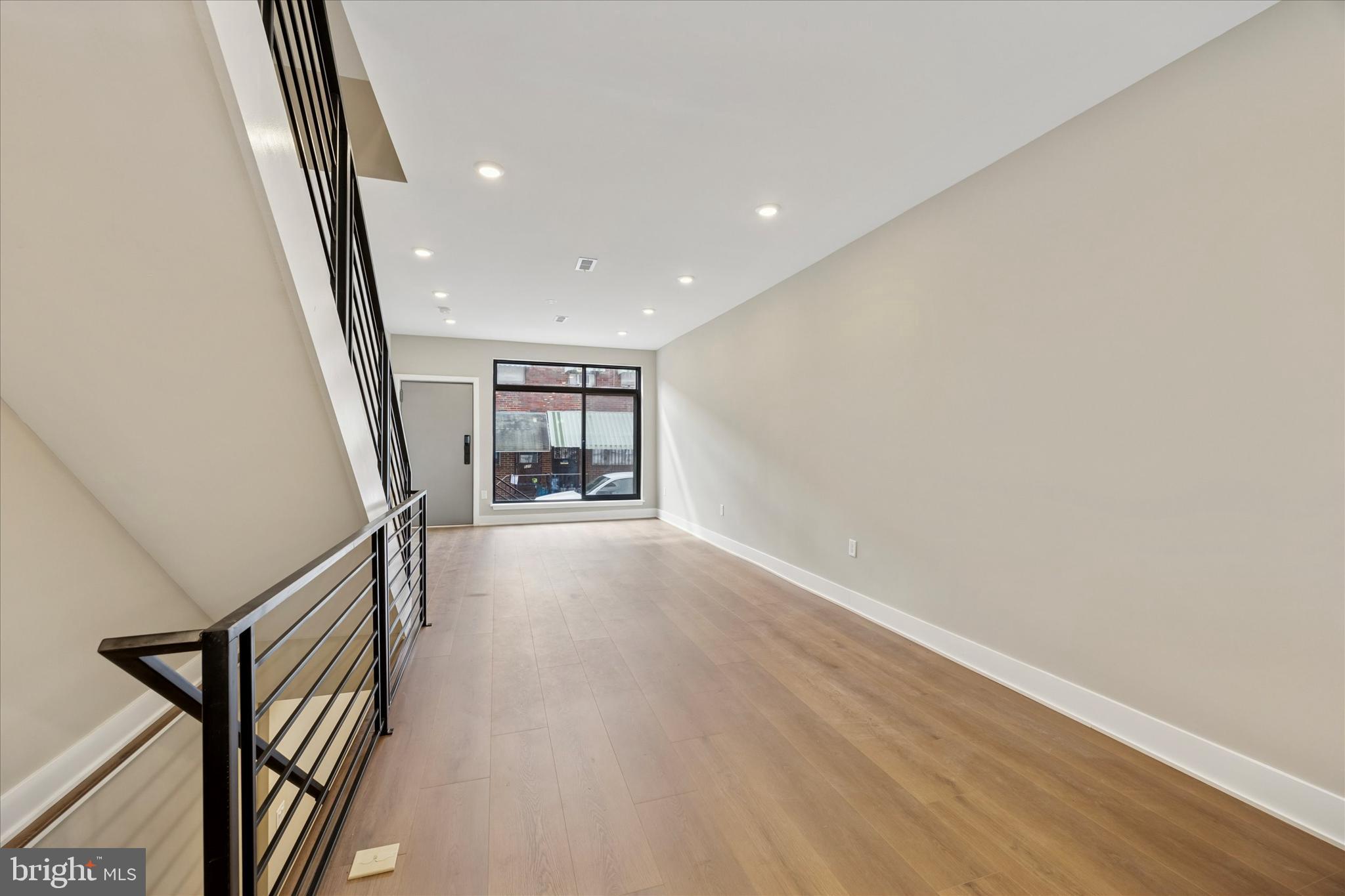 523 Gerritt Street Philadelphia, PA 19147 - Photo 13 of 35 a view of an empty room with wooden floor and stairs