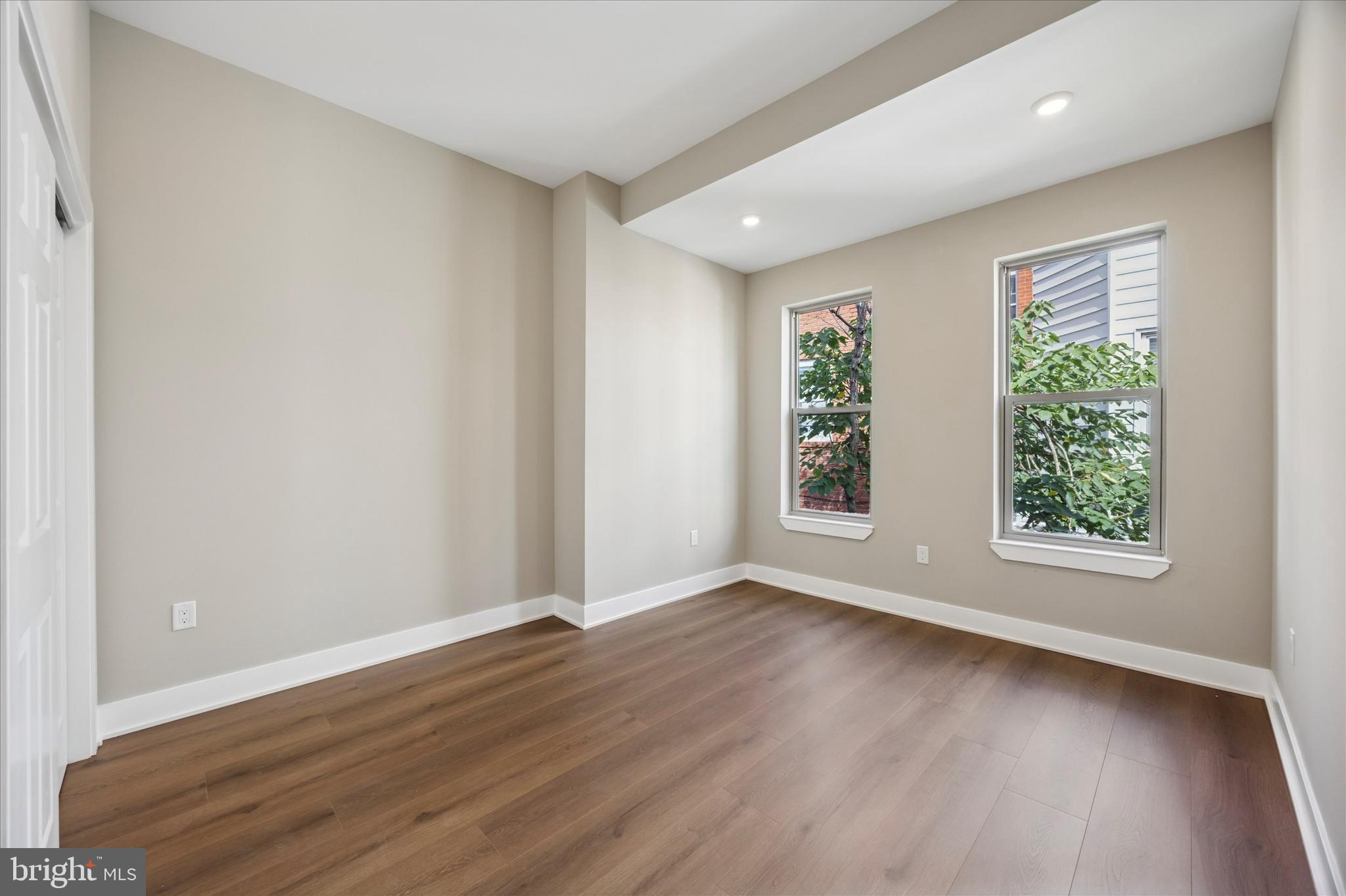 523 Gerritt Street Philadelphia, PA 19147 - Photo 16 of 35 an empty room with wooden floor and windows
