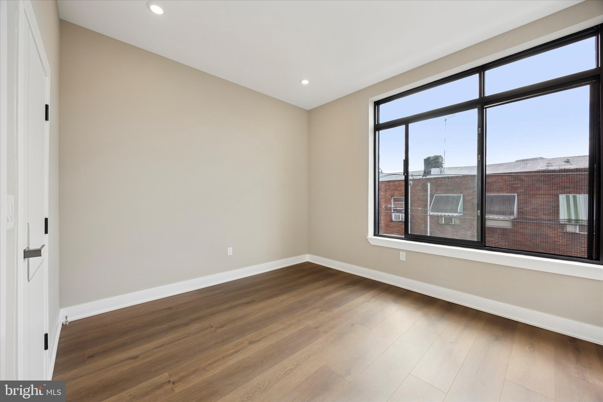 523 Gerritt Street Philadelphia, PA 19147 - Photo 23 of 35 wooden floor in an empty room with a window