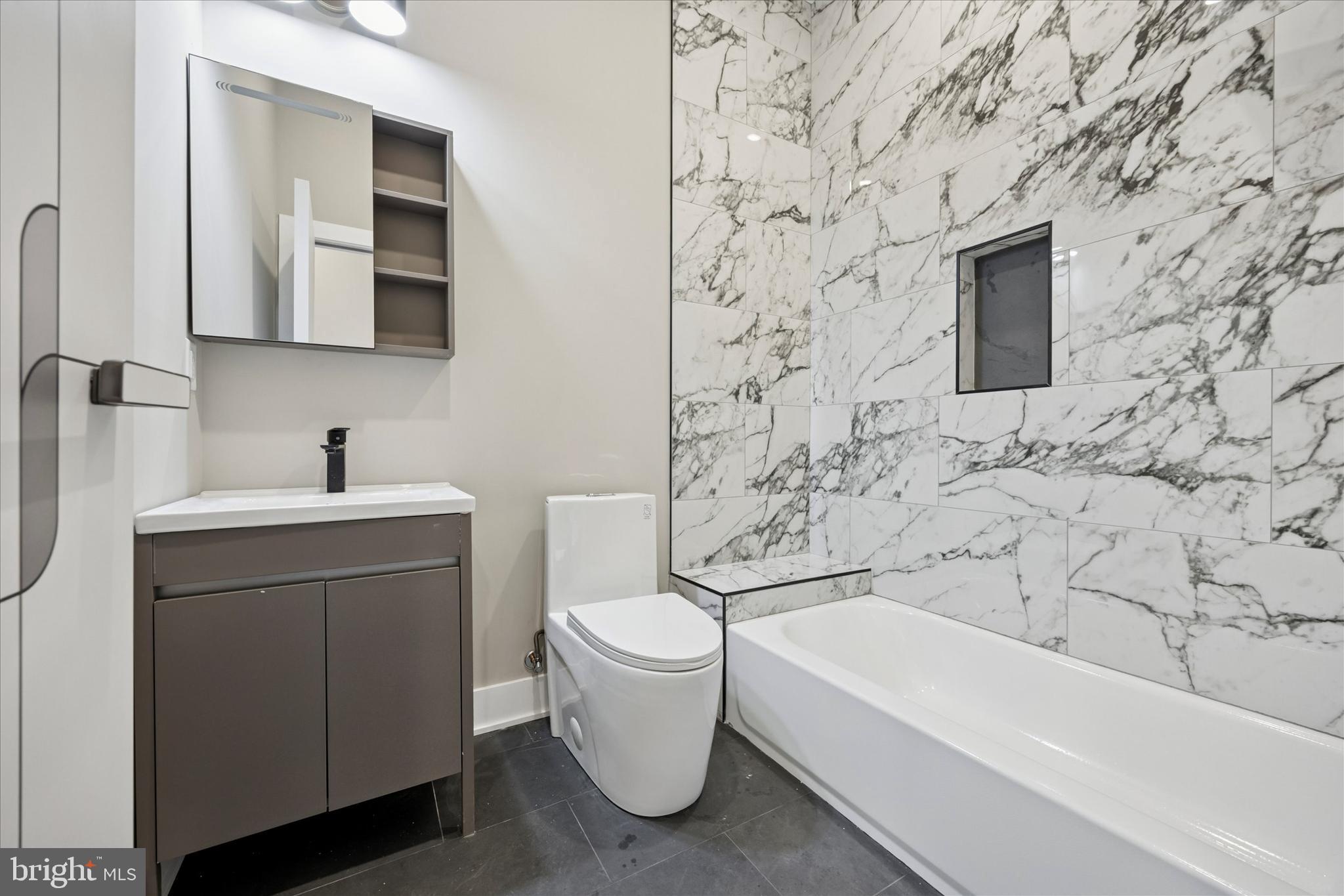 523 Gerritt Street Philadelphia, PA 19147 - Photo 24 of 35 a bathroom with a toilet sink and mirror