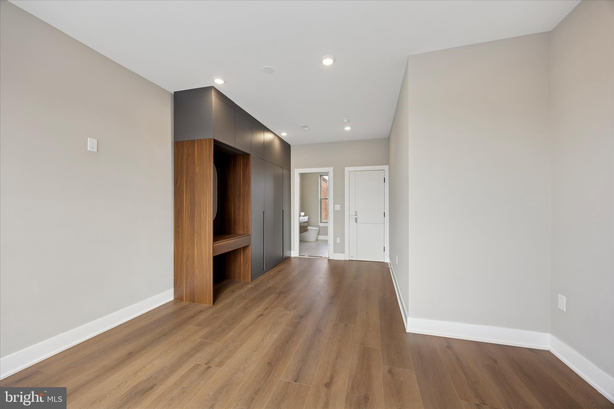 523 Gerritt Street Philadelphia, PA 19147 - Photo 28 of 35 a view of a hallway with wooden floor and a living room