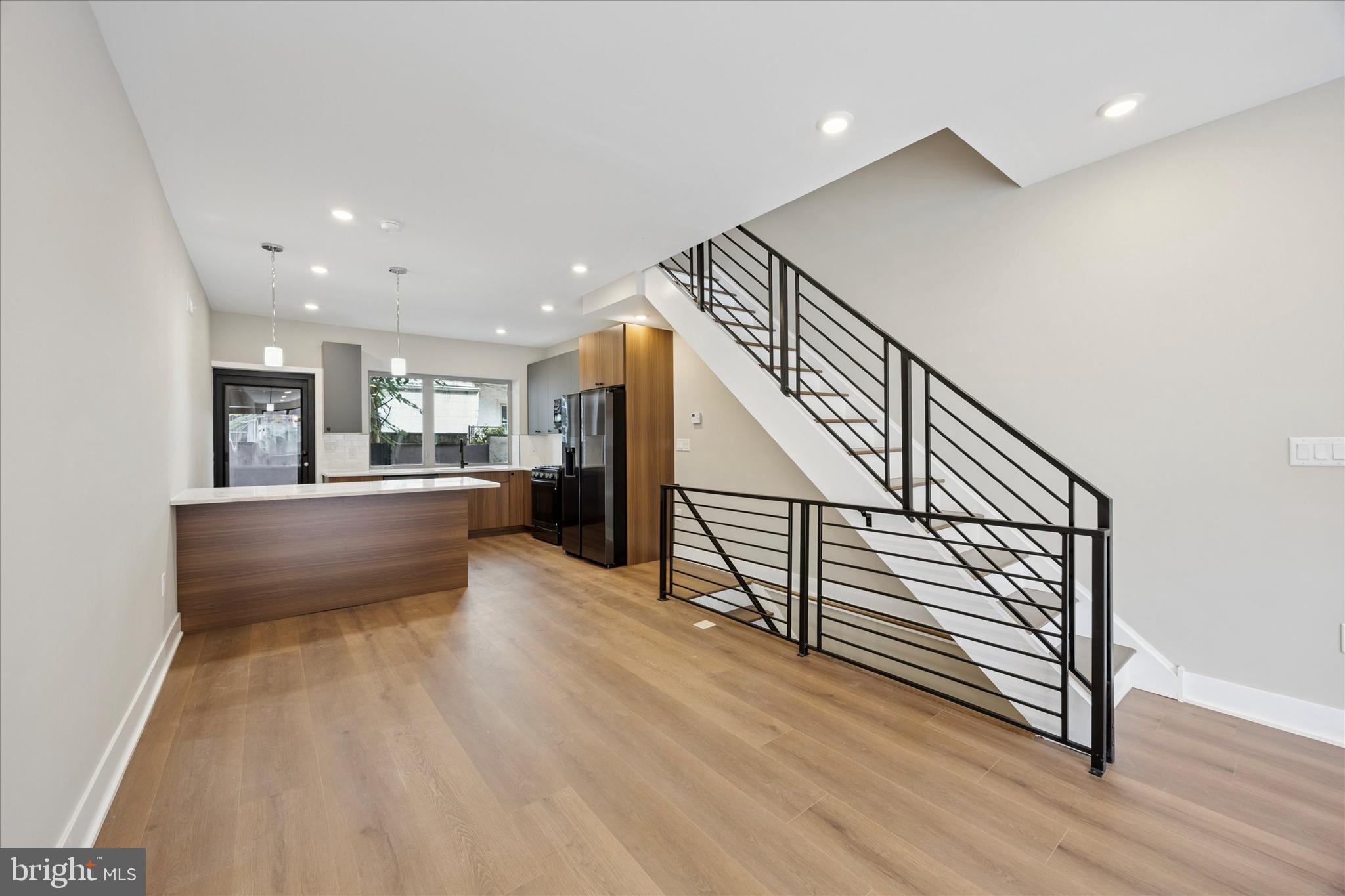 523 Gerritt Street Philadelphia, PA 19147 - Photo 3 of 35 a view of kitchen and hall with wooden floor