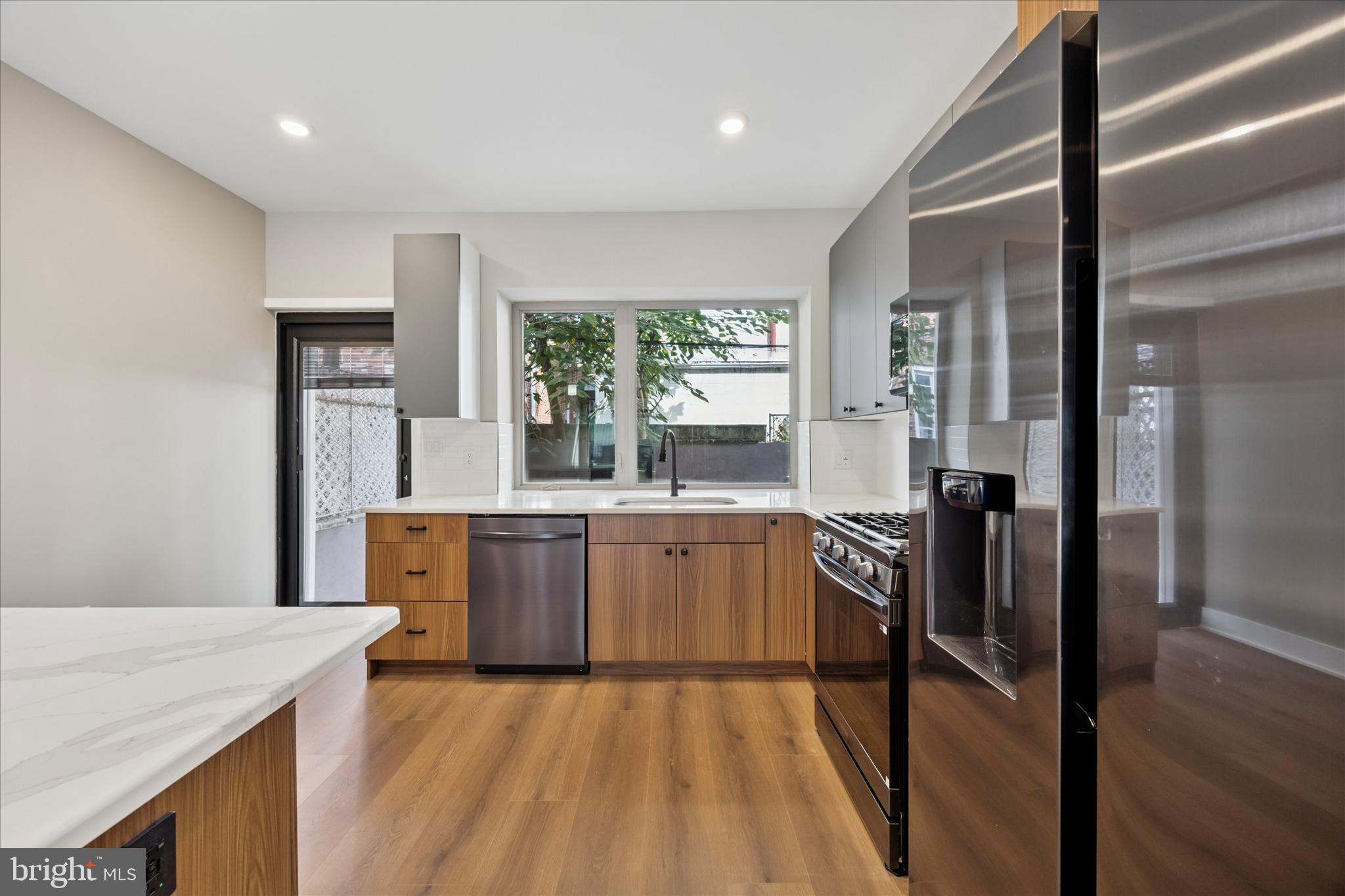 523 Gerritt Street Philadelphia, PA 19147 - Photo 6 of 35 a kitchen with a sink stove and refrigerator