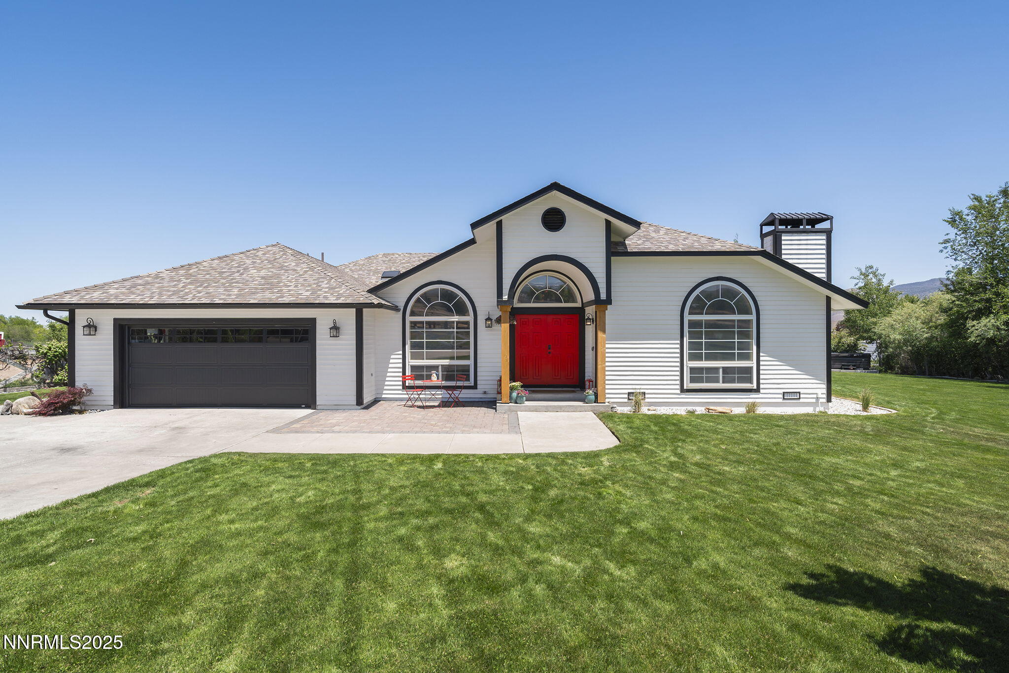 13060 Valley Springs Road Reno, NV 89511 - Photo 3 of 54 a view of front of a house with garage and yard