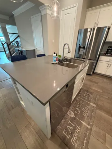 a bathroom with a sink a mirror and a shower