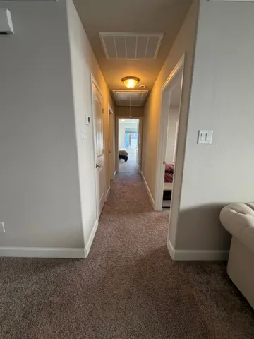 a view of a hallway with staircase