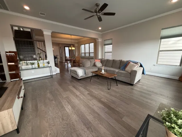 a living room with furniture and a large window