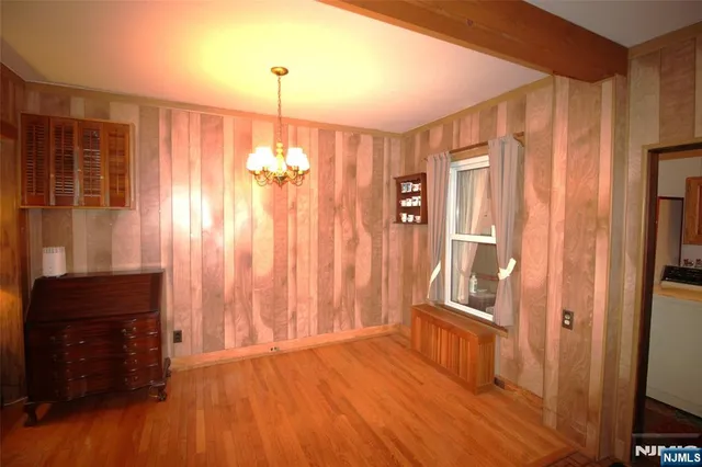 a bedroom with bed and a window