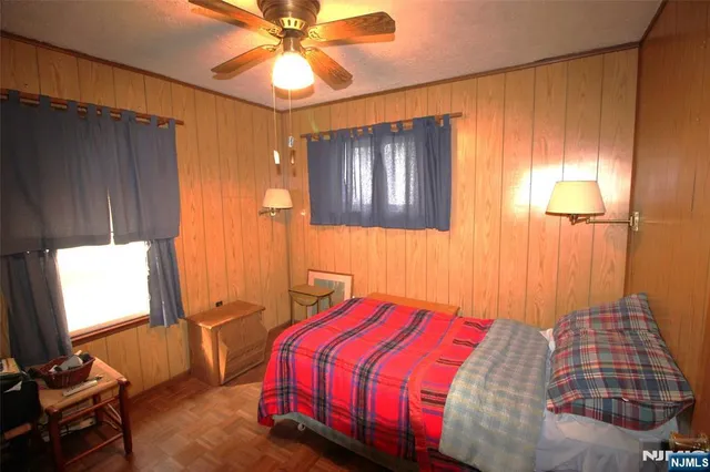 a bedroom with a bed and a shower