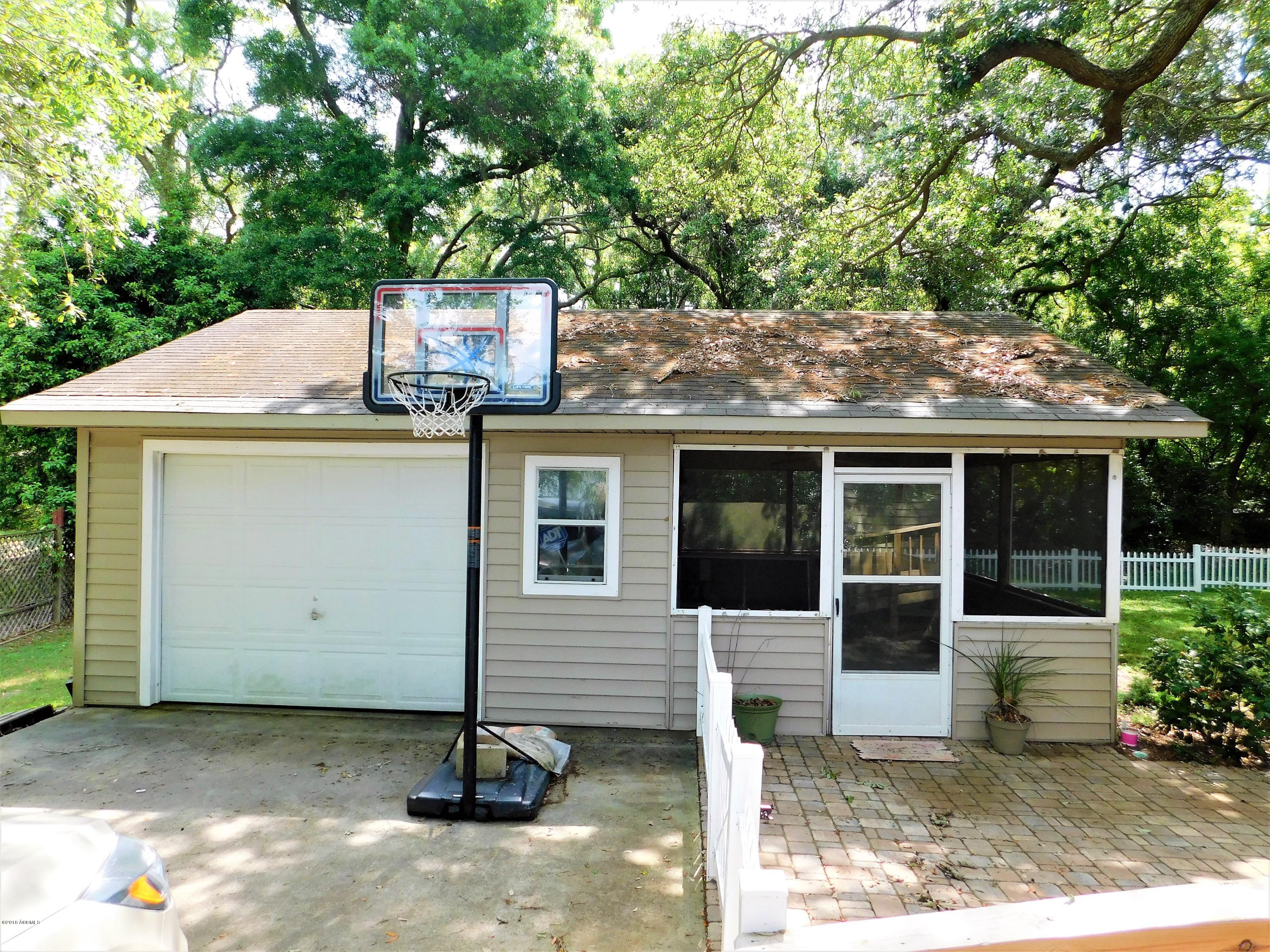 84 Bay Point Road St. Helena Island, SC 29920 - Photo 17 of 45 Garage and Screened porch