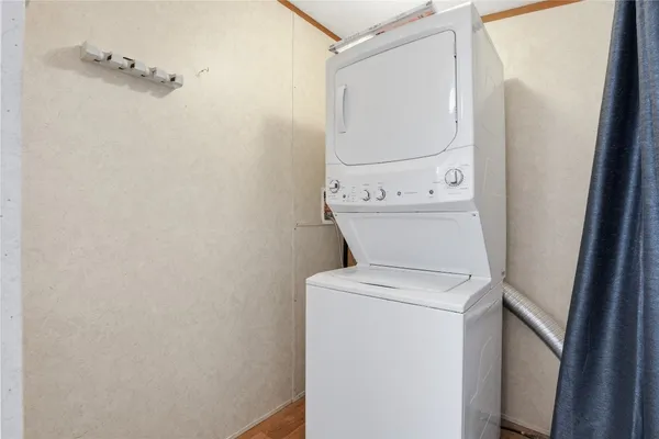 a view of bathroom with a washer and dryer