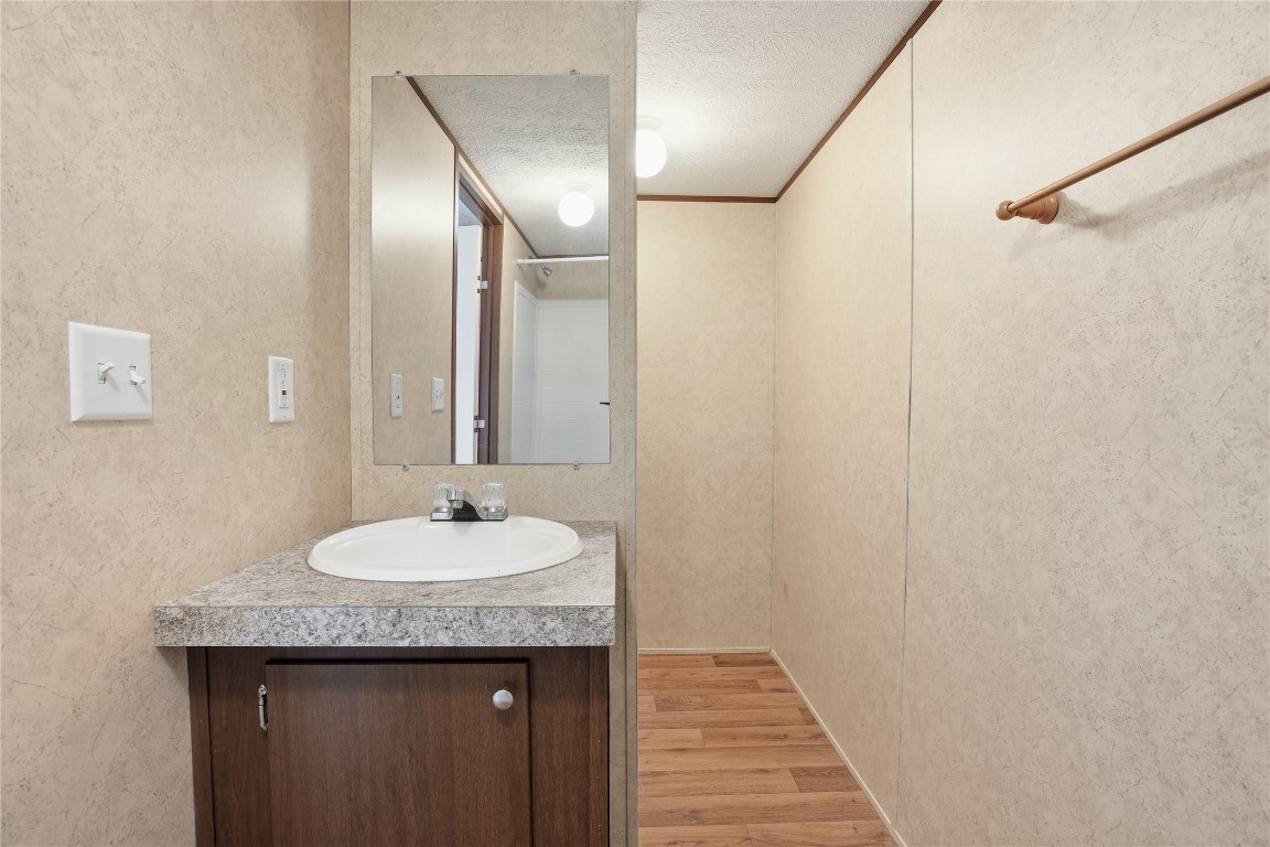 801 Genoa Red Bluff Road Pasadena, TX 77504 - Photo 21 of 33 a bathroom with a granite countertop sink and a mirror