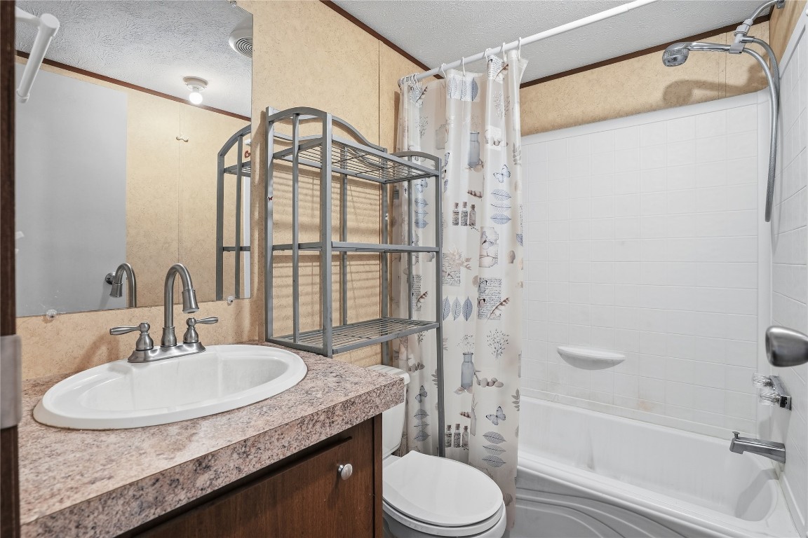 801 Genoa Red Bluff Road Pasadena, TX 77504 - Photo 24 of 33 a bathroom with a granite countertop sink toilet and shower