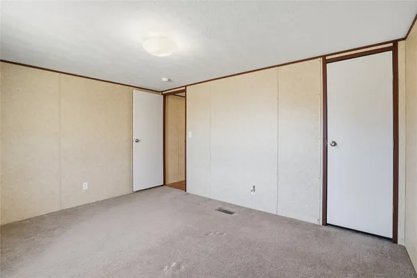 a backyard of a house with large trees