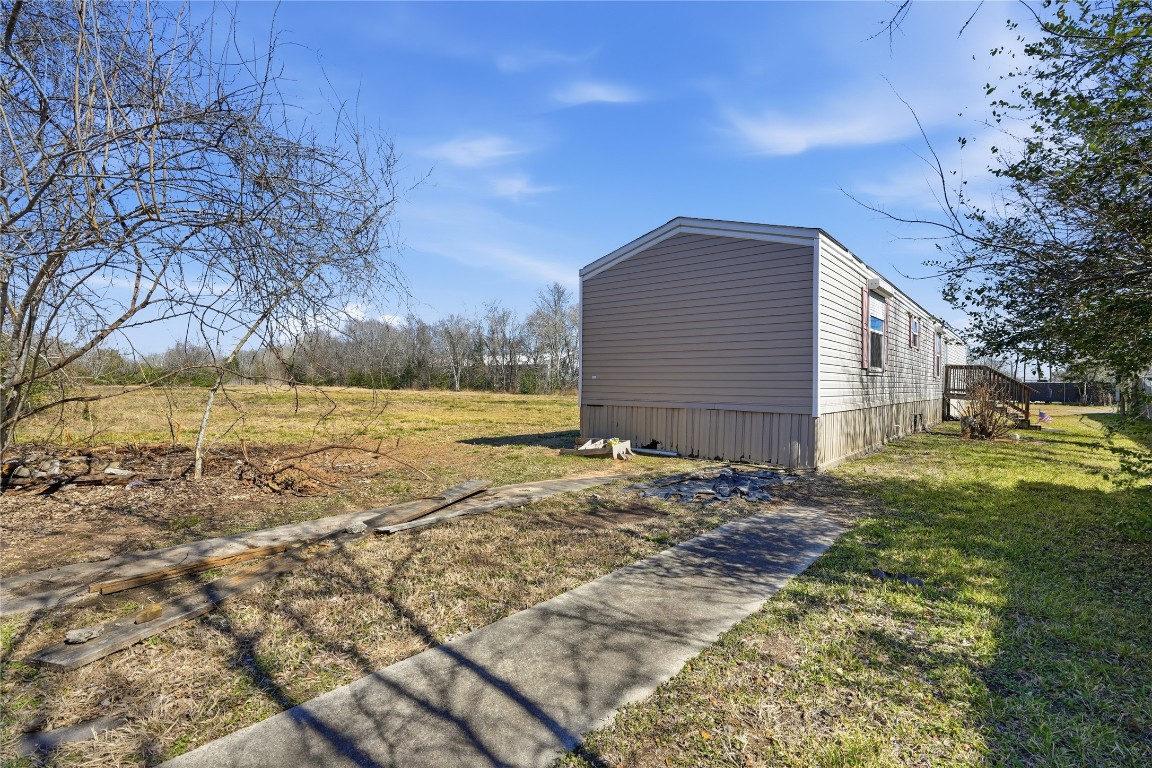 801 Genoa Red Bluff Road Pasadena, TX 77504 - Photo 27 of 33 a backyard of a house with large trees
