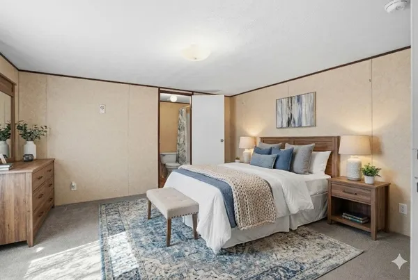 a bedroom with a bed and a table in it