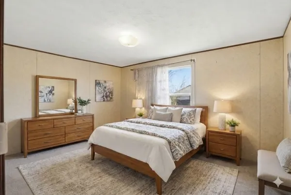 a bedroom with a bed and a dresser