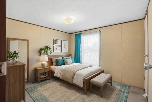 a bedroom with a bed a table and a window