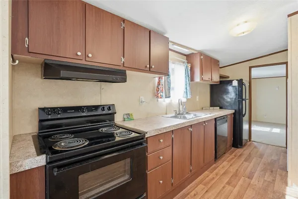a kitchen with a stove and a refrigerator