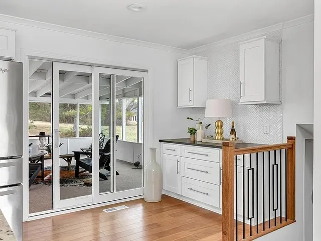 a kitchen with stainless steel appliances granite countertop a stove and a refrigerator