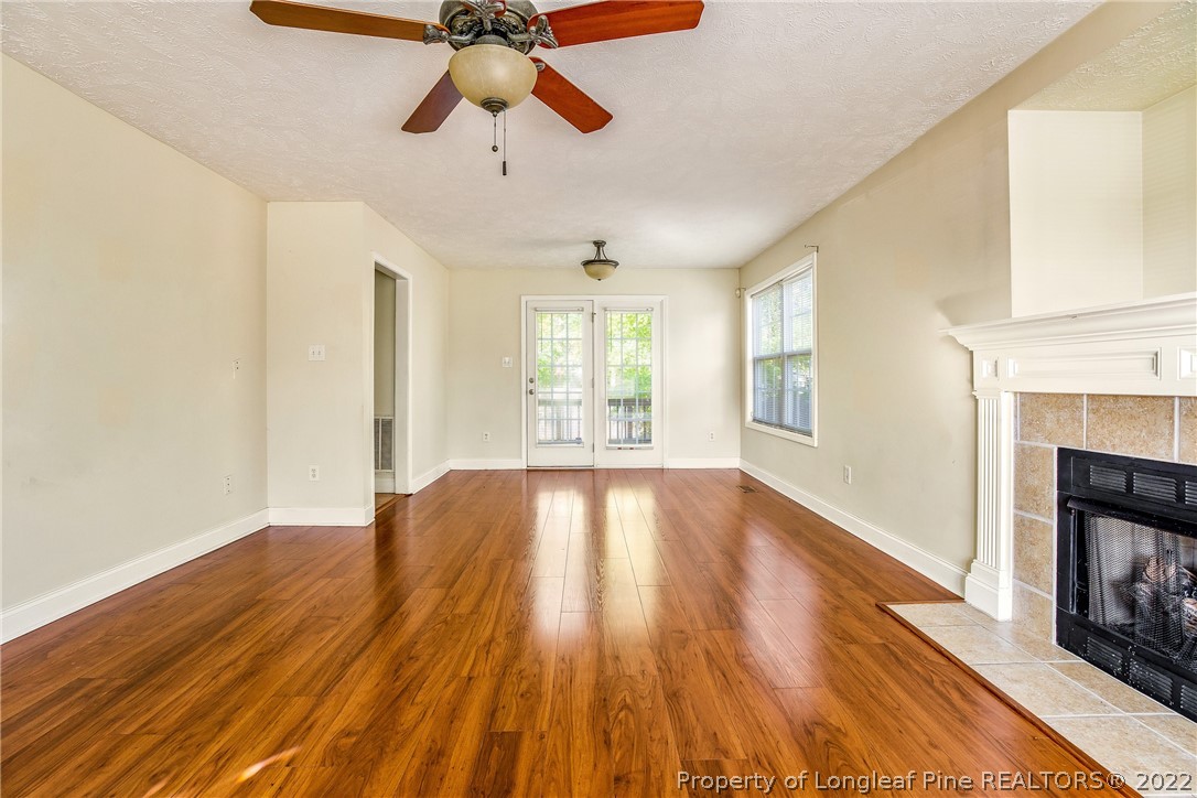 1631 Silver Ridge Court Fayetteville, NC 28304 - Photo 11 of 21 a view of an empty room with wooden floor and a window