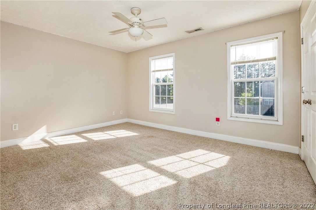 1631 Silver Ridge Court Fayetteville, NC 28304 - Photo 15 of 21 a view of empty room with wooden floor and fan