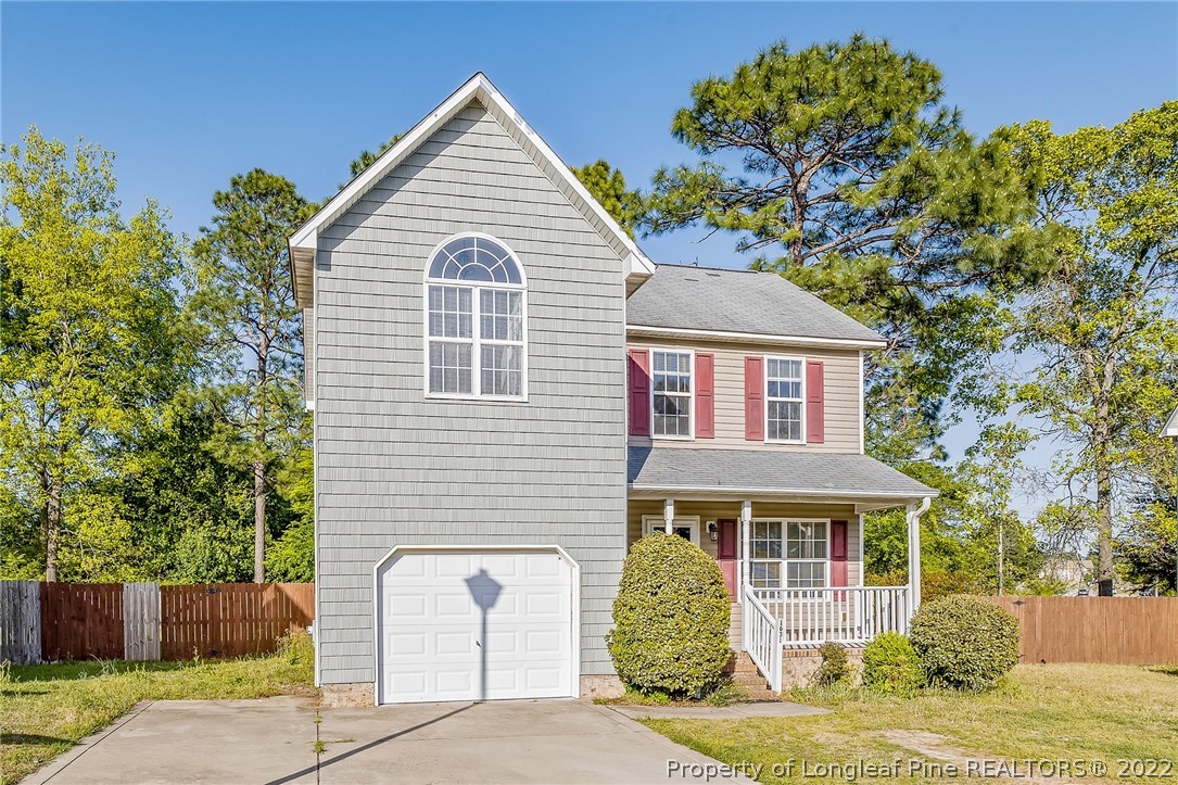 1631 Silver Ridge Court Fayetteville, NC 28304 - Photo 2 of 21 a front view of a house with a garden