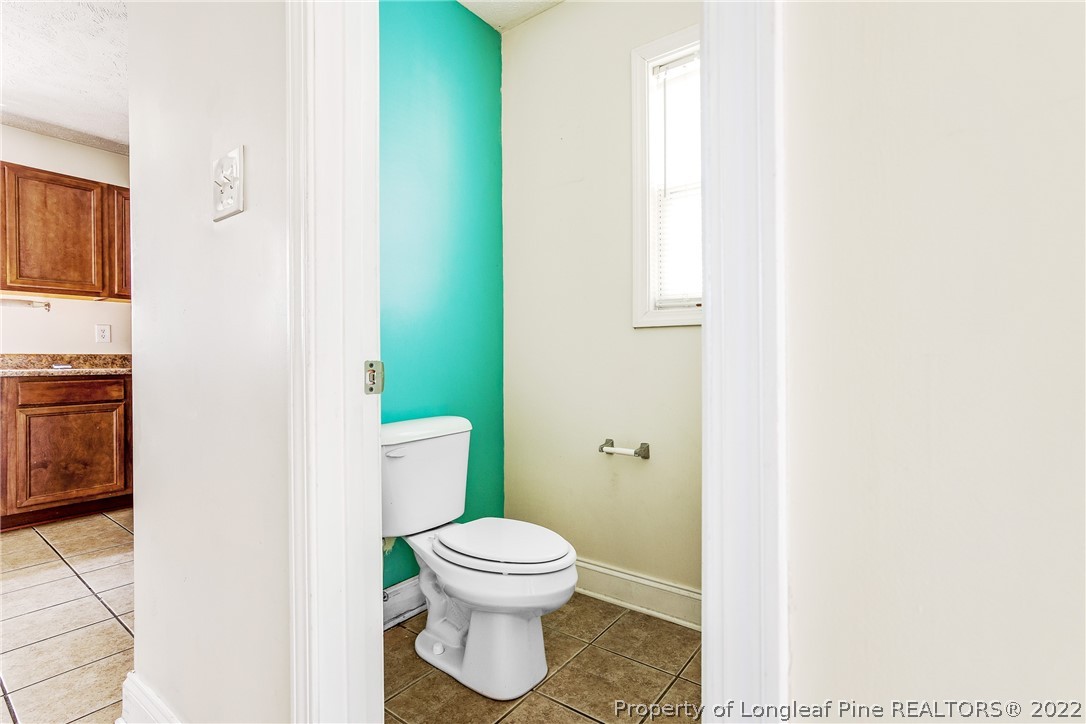 1631 Silver Ridge Court Fayetteville, NC 28304 - Photo 10 of 21 a bathroom with a toilet and a sink