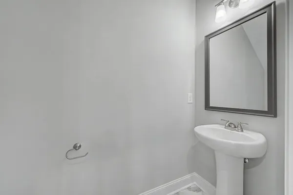 a bathroom with a sink and mirror