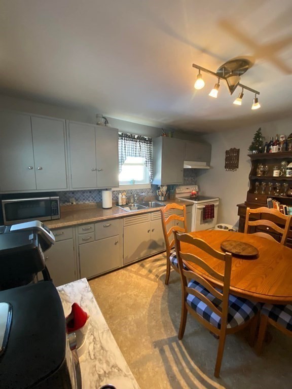 62 Lenox Circle Athol, MA 01331 - Photo 4 of 13 a kitchen with a sink refrigerator and cabinets