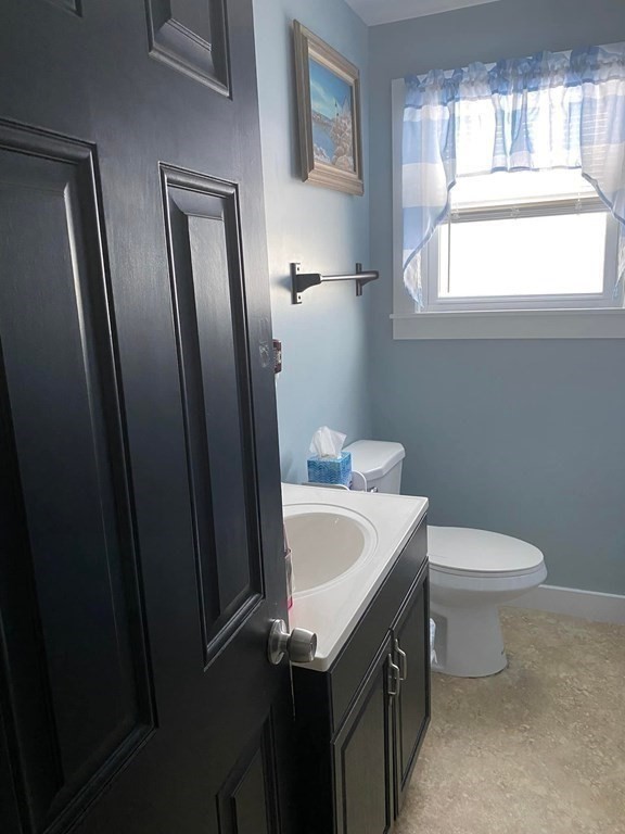 62 Lenox Circle Athol, MA 01331 - Photo 7 of 13 a bathroom with a sink a toilet and mirror