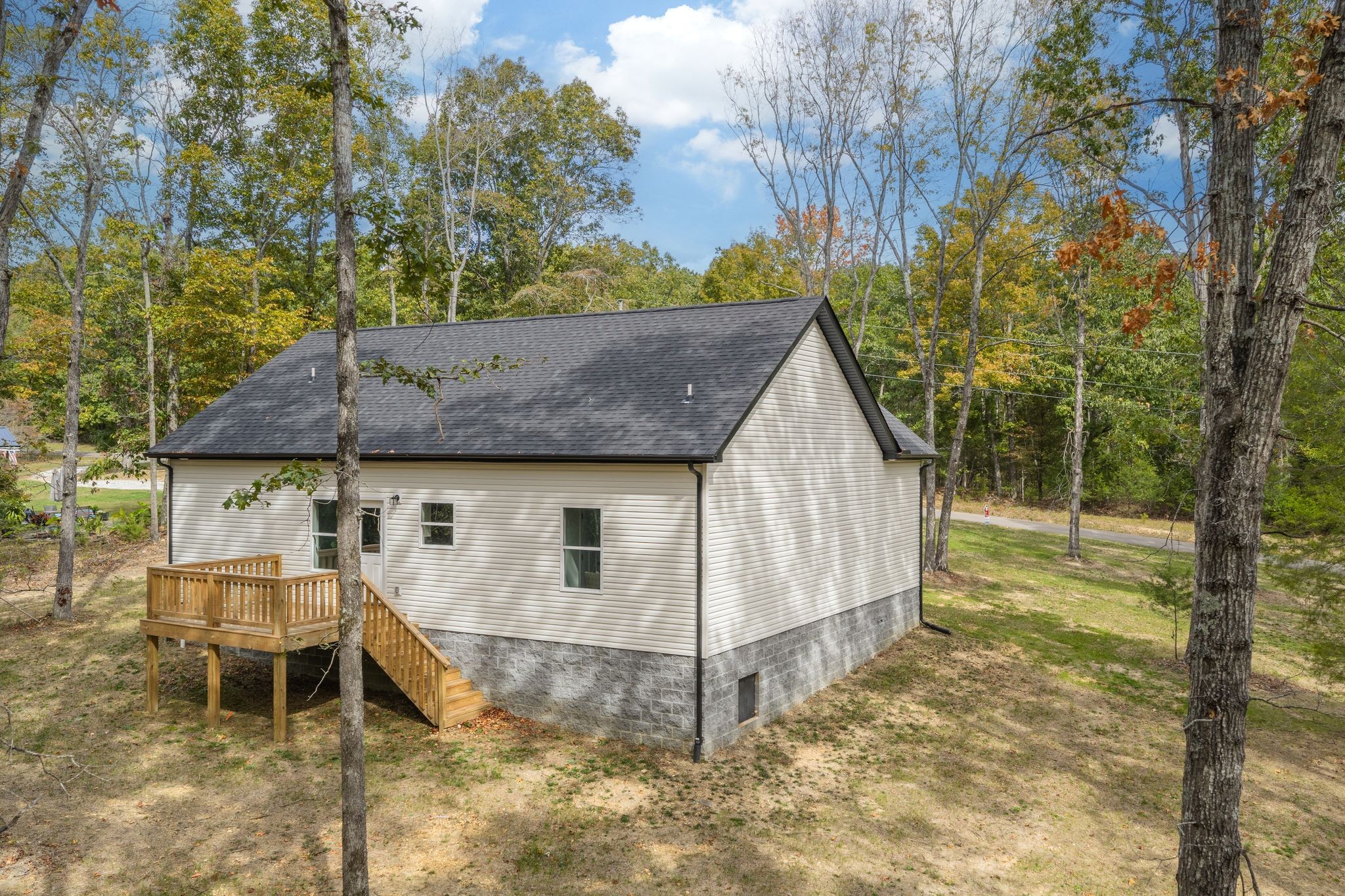 762 Billy Wynn Road Dickson, TN 37055 - Photo 37 of 38 a view of a house with a yard and sitting area