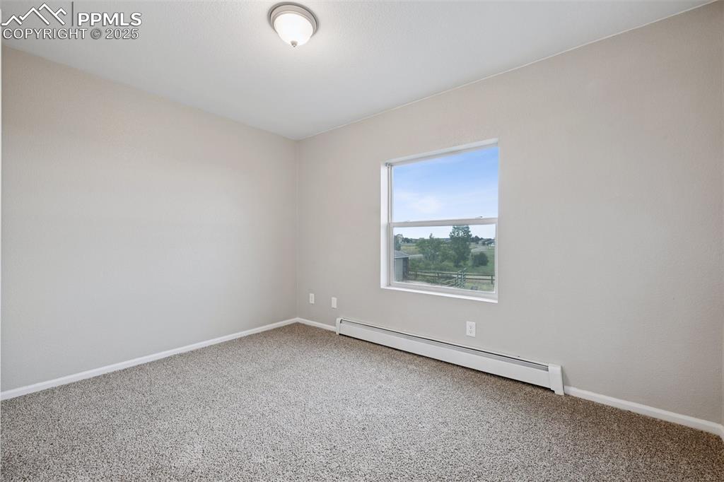 13490 Halleluiah Trail Elbert, CO 80106 - Photo 18 of 38 an empty room with a window