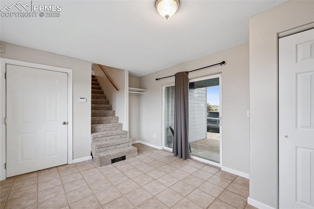 13490 Halleluiah Trail Elbert, CO 80106 - Photo 24 of 38 a view of a livingroom with wooden floor and stairs