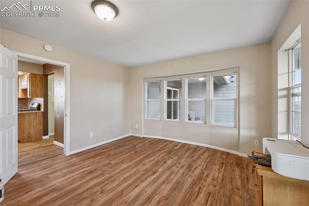 13490 Halleluiah Trail Elbert, CO 80106 - Photo 26 of 38 a view of empty room with wooden floor and fan