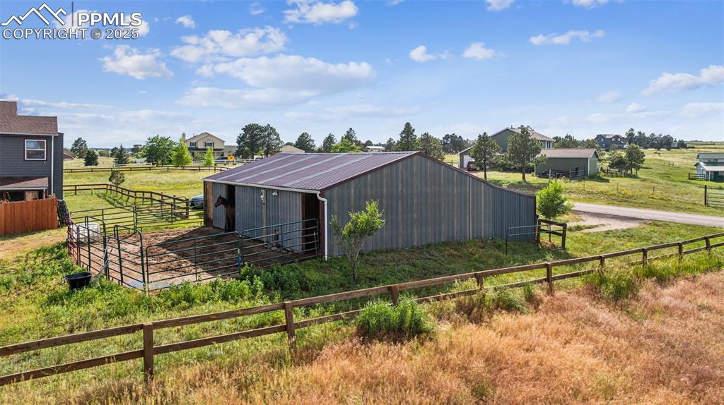 13490 Halleluiah Trail Elbert, CO 80106 - Photo 3 of 38 a view of a house with a big yard and wooden fence