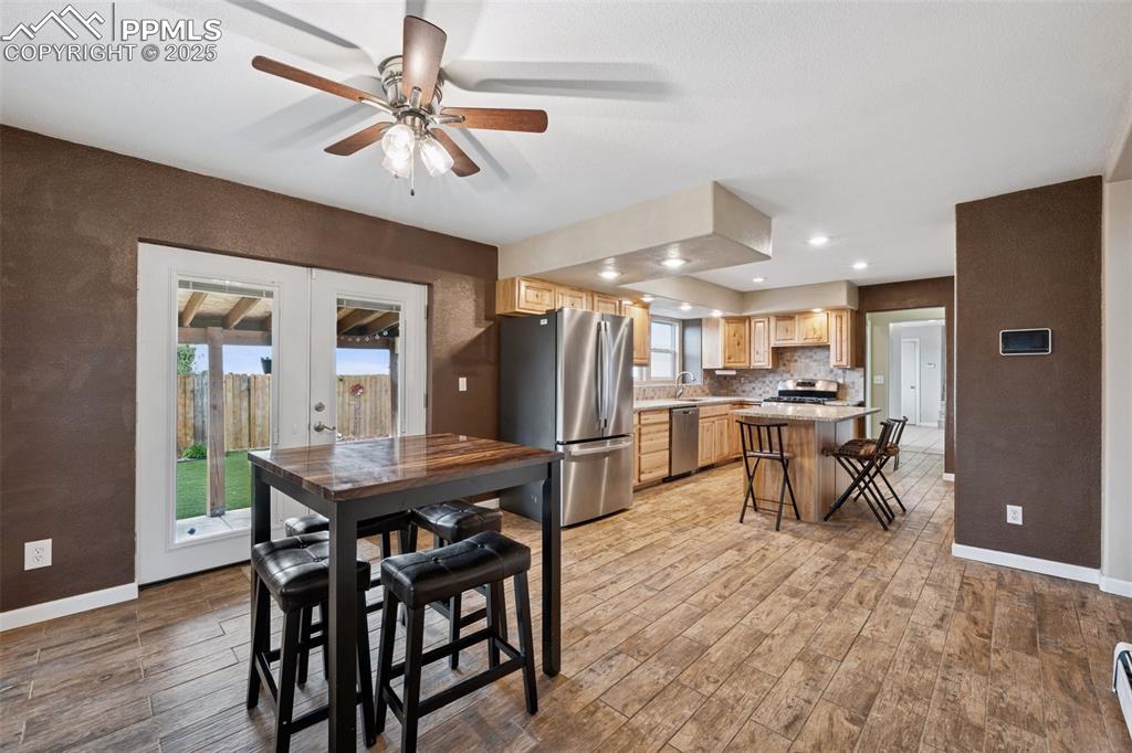 13490 Halleluiah Trail Elbert, CO 80106 - Photo 6 of 38 a view of a dining room with furniture and wooden floor